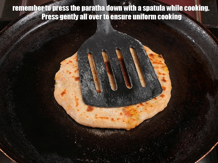 Step 45 – Remember to press the paratha down with a spatula while cooking. Press gently all over …