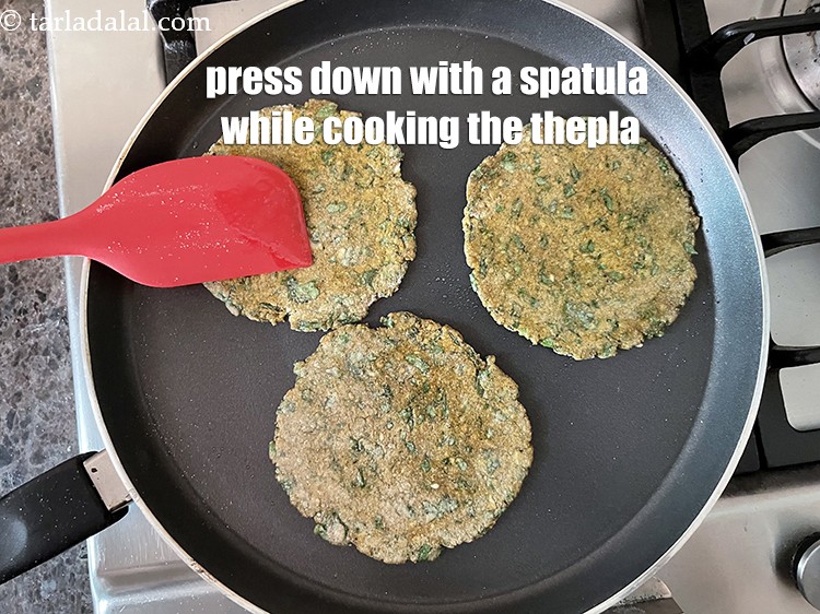 Step 45 – Remember to press down with a spatula while your thepla is being cooked.