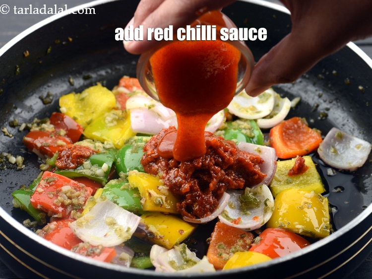 Step 37 – Add 1 tbsp&nbsp;<a href="https://www.tarladalal.com/glossary-red-chilli-sauce-lal-chilli-sauce-810i">red chilli sauce</a>.