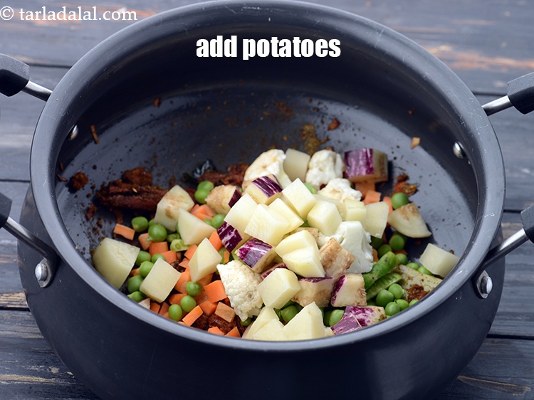 Step 38 – Add 1/4 cup&nbsp;<a href="https://www.tarladalal.com/glossary-potato-cubes-725i">potato cubes</a>.&nbsp;