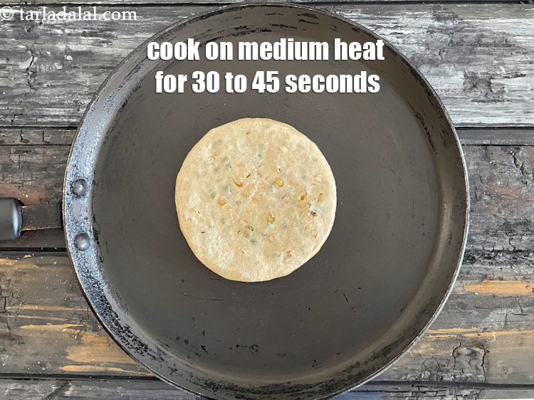 Step 38 – <meta charset="UTF-8" /> Cook paratha on hot non-stick tava (griddle) &nbsp;on medium heat for 30 …