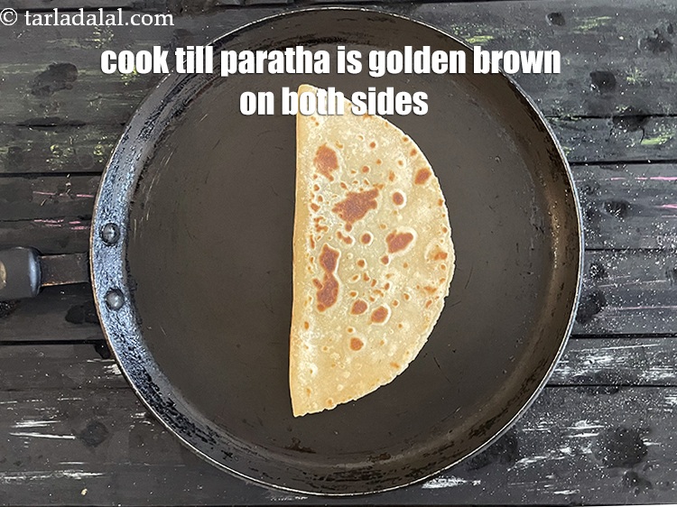 Step 39 – <meta charset="UTF-8" /> Cook paratha till golden brown on both sides.&nbsp;Your paratha is ready.&nbsp;&nbsp;<br /> …
