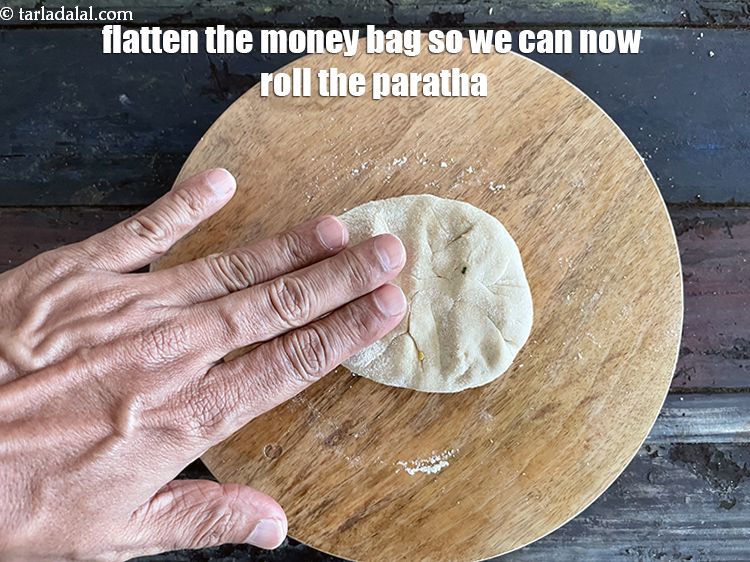 Step 53 – Flatten the money bag so we can now roll the paratha.