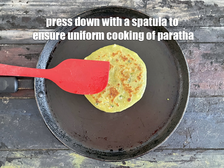 Step 45 – <meta charset="UTF-8" /> Always use a spaltula and press down while cooking the paratha. This …
