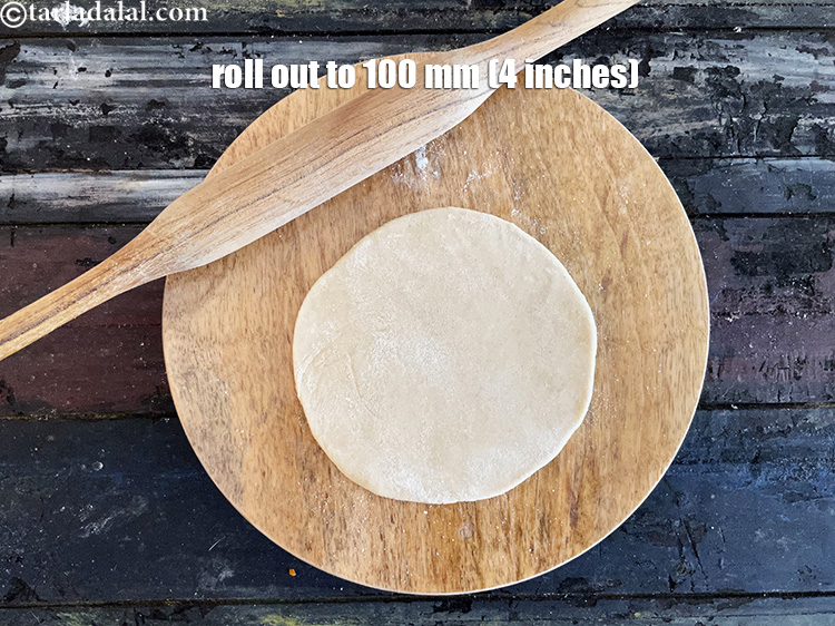 Step 35 – <meta charset="UTF-8" /> Roll a portion of the dough into a 100 mm. (4&rdquo;) diameter …