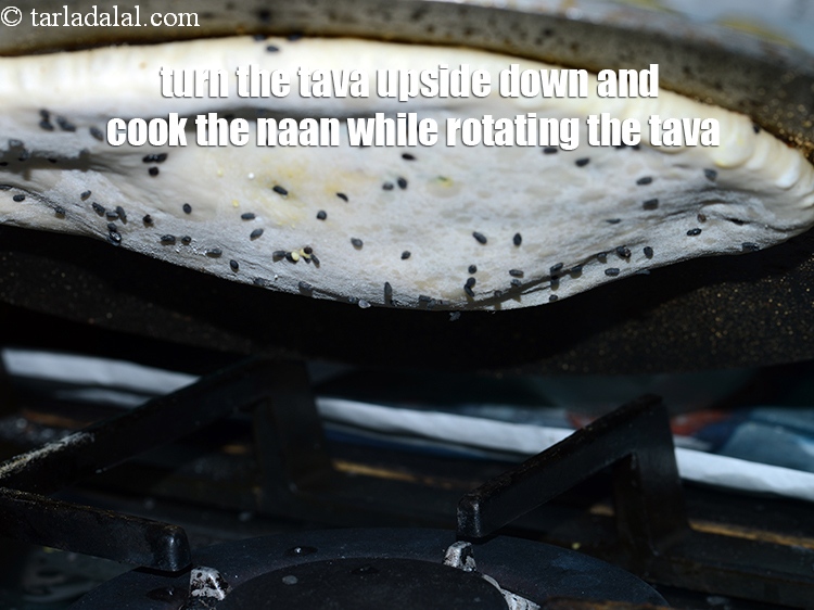 Step 40 – Turn the tava upside down on an open flame and cook the naan again while …