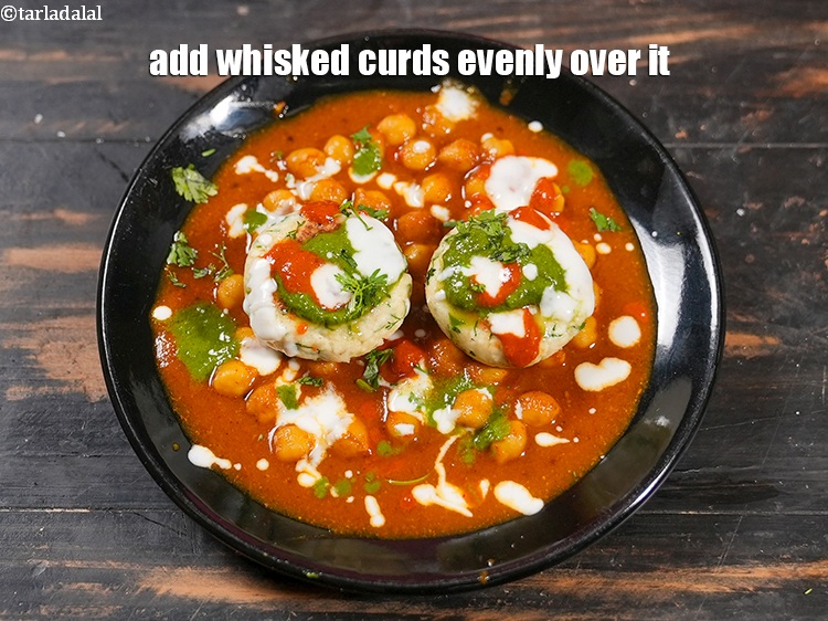 Step 37 – Add 1 tbsp&nbsp;<a href="https://www.tarladalal.com/glossary-whisked-curds--2096i">whisked curds (dahi)</a>&nbsp;evenly over it.