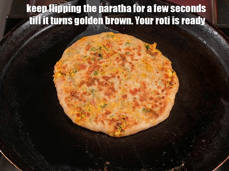 Step 46 – <meta charset="UTF-8" /> Keep flipping the paratha for a few seconds till it turns golden …