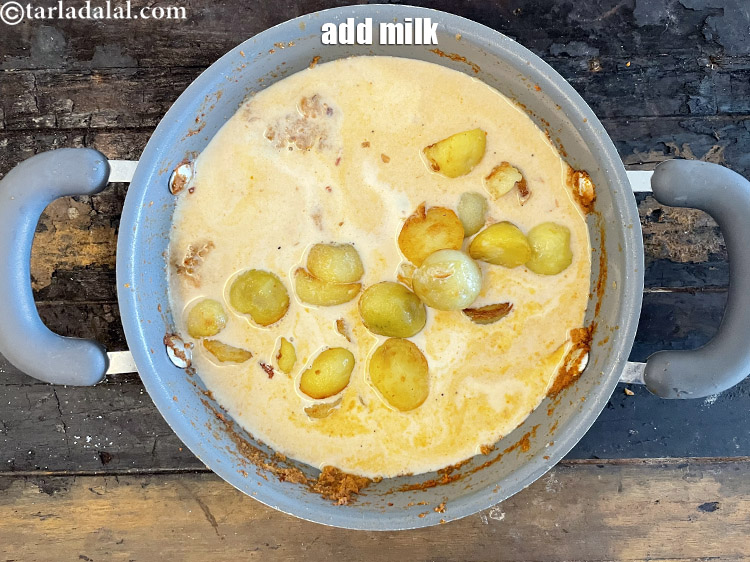 Step 56 – Add&nbsp;<meta charset="UTF-8" />3/4 cup&nbsp;<a href="glossary-milk-doodh-full-fat-milk-buffalo-milk-full-cream-milk-514i">milk</a>.