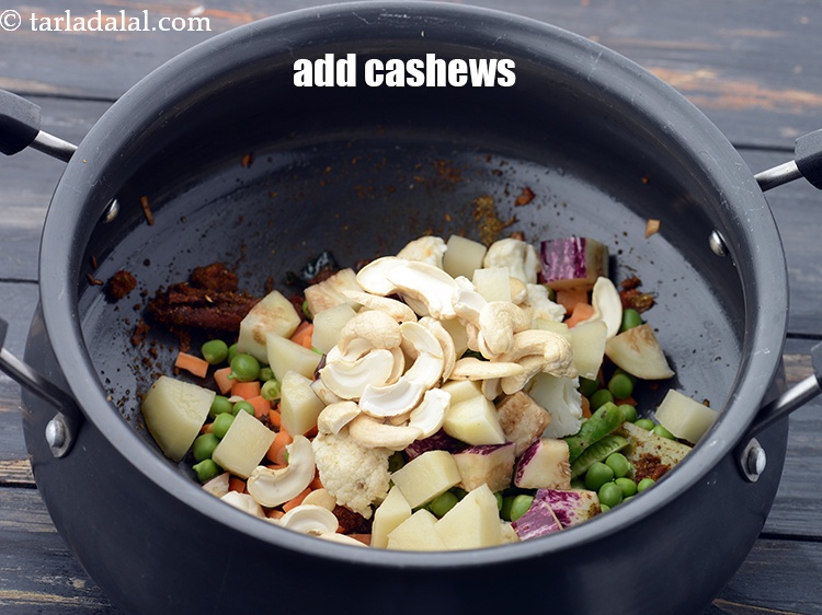 Step 39 – Add 1/4 cup&nbsp;broken&nbsp;<a href="https://www.tarladalal.com/glossary-cashew-nuts-kaju-840i">cashew nuts (kaju)</a>.&nbsp;
