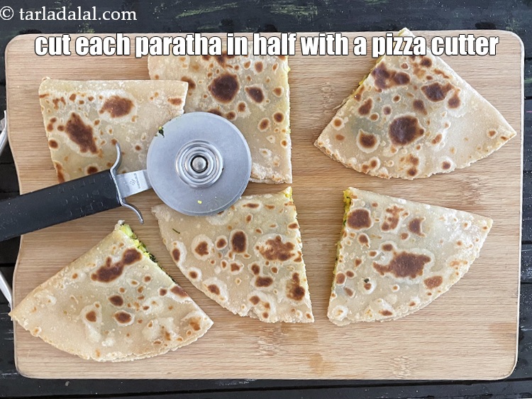 Step 40 – Cut each paratha in half with a pizza cutter.