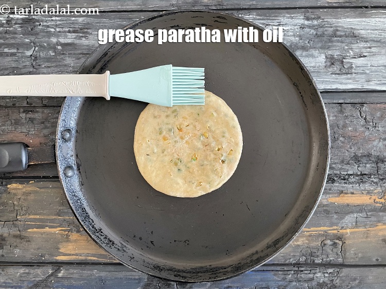 Step 39 – Grease paratha with oil.