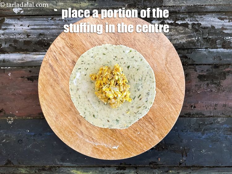 Step 49 – Place a portion of the stuffing in the centre.