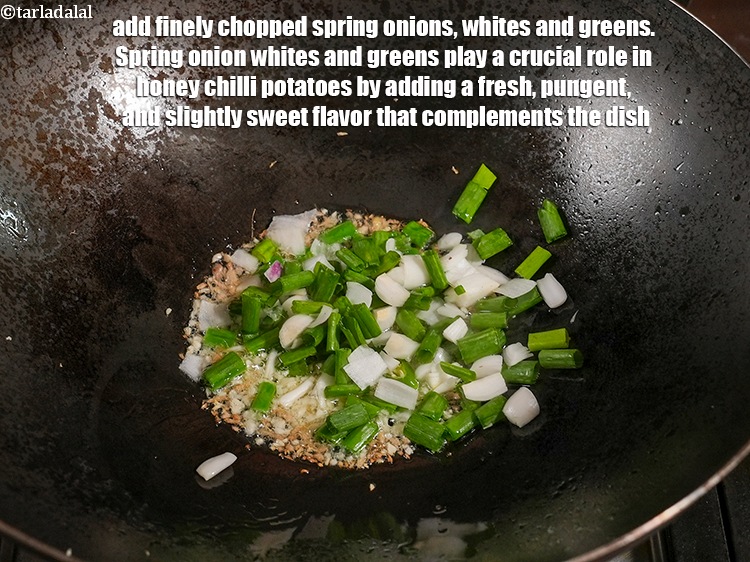 Step 38 – Add &frac14; cup finely <a href="https://www.tarladalal.com/glossary-chopped-spring-onion-whites-815i">chopped spring onions whites</a>&nbsp;and greens. Spring onion whites and greens …
