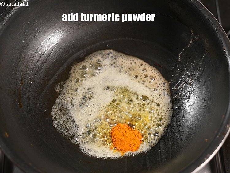 Step 40 – Add &frac12; tsp <a href="https://www.tarladalal.com/glossary-turmeric-powder-haldi-645i">turmeric powder (haldi)</a>.&nbsp;