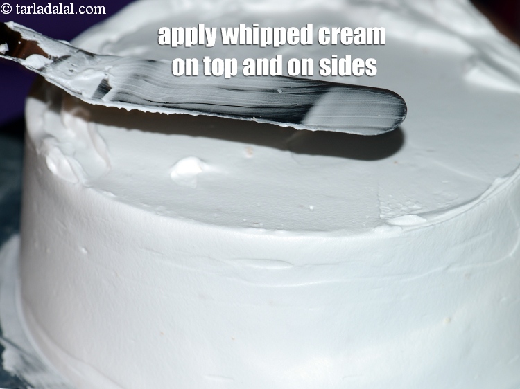 Step 41 – Apply whipped cream on the top and on the sides of the cake.