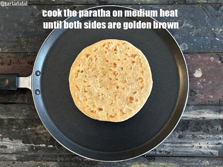 Step 49 – <meta charset="UTF-8" />Cook the paratha on medium heat until both sides are golden brown.&nbsp;<br /> …