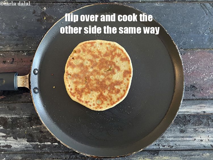 Step 55 – <meta charset="UTF-8" /> Flip over and cook the other side of the&nbsp;paratha the same way.