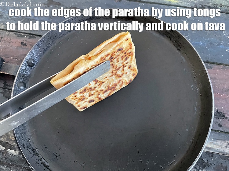 Step 41 – We need to cook the 4 edges of the envelope paratha. So take a pair …