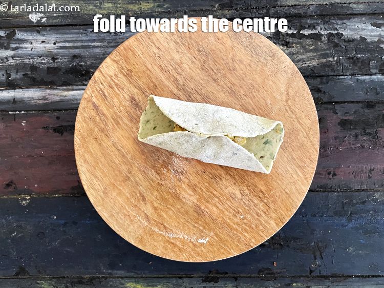 Step 50 – Fold the edges towards the centre.
