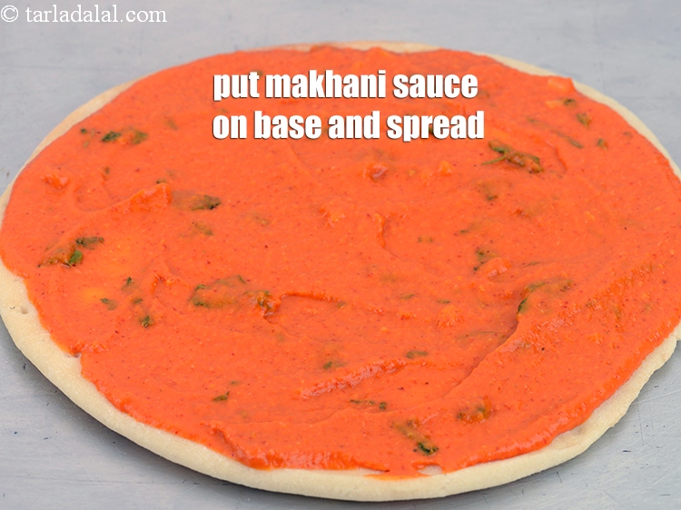 Step 41 – Put &frac14; cup makhani sauce on each pizza base and spread it evenly.