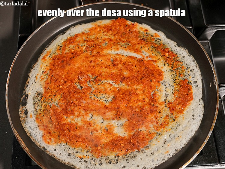 Step 40 – Evenly over the dosa using a spatula.