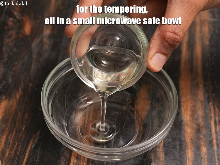 Step 40 – Meanwhile, for the tempering, 2 tsp <a href="https://www.tarladalal.com/glossary-oil-671i">oil</a> in a small microwave safe bowl.