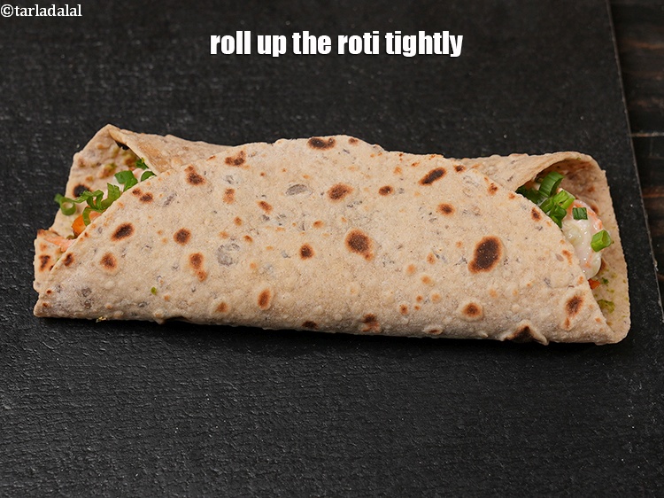 Step 40 – Roll up the roti tightly.