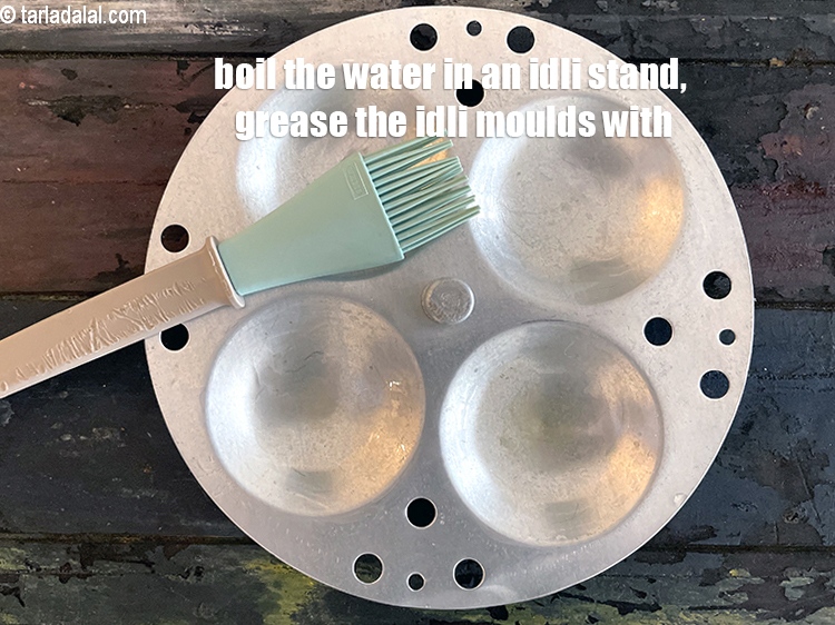 Step 40 – Boil the water in idli/ dhokla maker. Grease the idli moulds with oil.