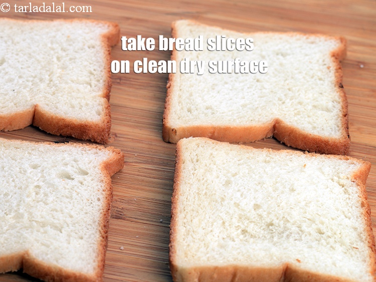 Step 42 – Take 16 <a href="https://www.tarladalal.com/glossary-bread-219i">bread</a> slices on a clean dry surface.&nbsp;