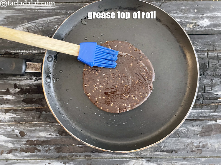 Step 50 – Grease the top of the roti.