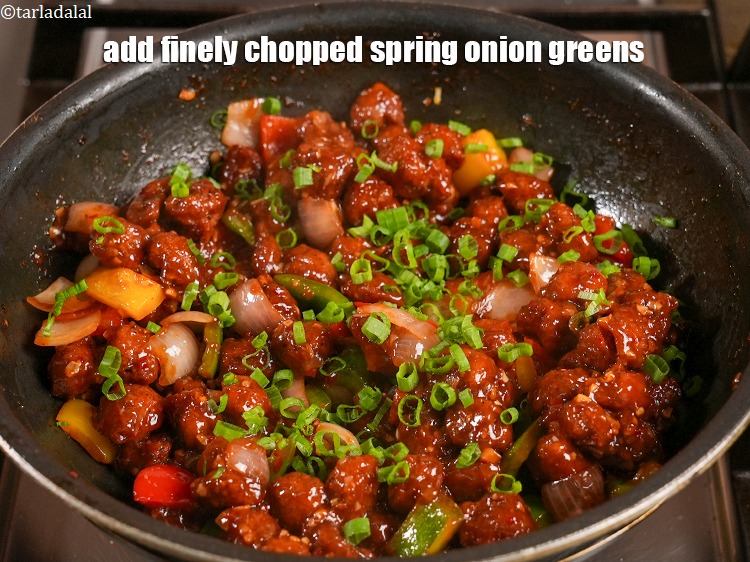 Step 41 – Add&nbsp;1/4 cup&nbsp;finely&nbsp;<a href="https://www.tarladalal.com/glossary-chopped-spring-onion-greens-1030i">chopped spring onion greens</a>.