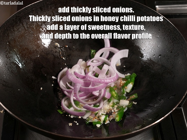 Step 40 – Add &frac12; cup thickly <a href="https://www.tarladalal.com/glossary-sliced-onions-745i">sliced onions</a>. Thickly sliced onions in honey chilli potatoes add …