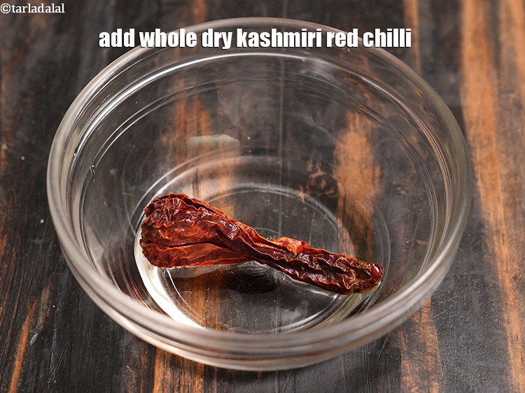Step 41 – Add 1 <a href="https://www.tarladalal.com/glossary-whole-dry-kashmiri-red-chillies-kashmiri-mirch-kashmiri-lal-mirch-332i">whole dry kashmiri red chilli</a>.