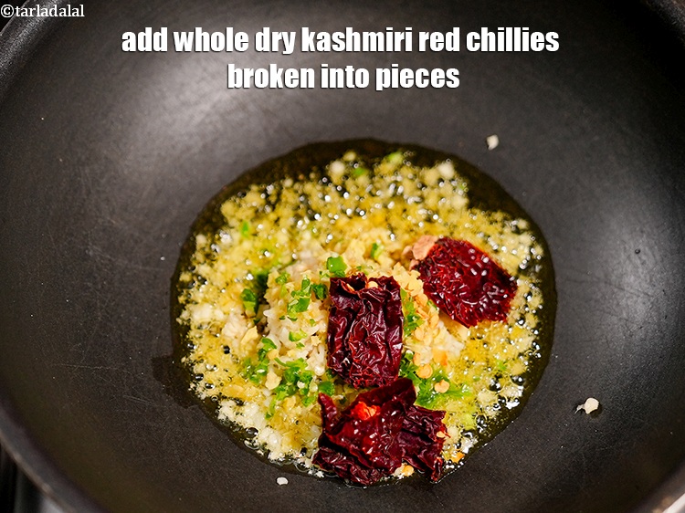 Step 41 – Add 2 <a href="https://www.tarladalal.com/glossary-whole-dry-kashmiri-red-chillies-kashmiri-mirch-kashmiri-lal-mirch-332i">whole dry kashmiri red chillies</a> broken into pieces.