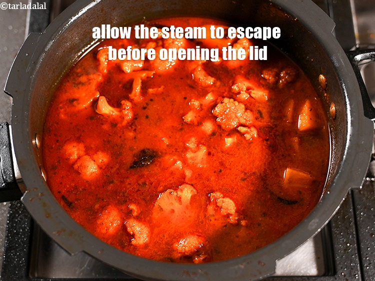 Step 41 – Allow the steam to escape before opening the lid.