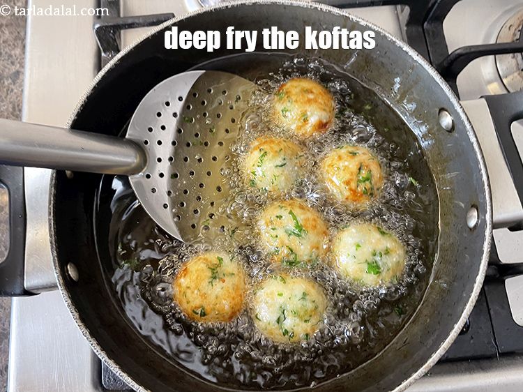 Step 40 – Heat the oil in a kadhai.&nbsp;Deep-fry the paneer koftas, a few at a time, till …