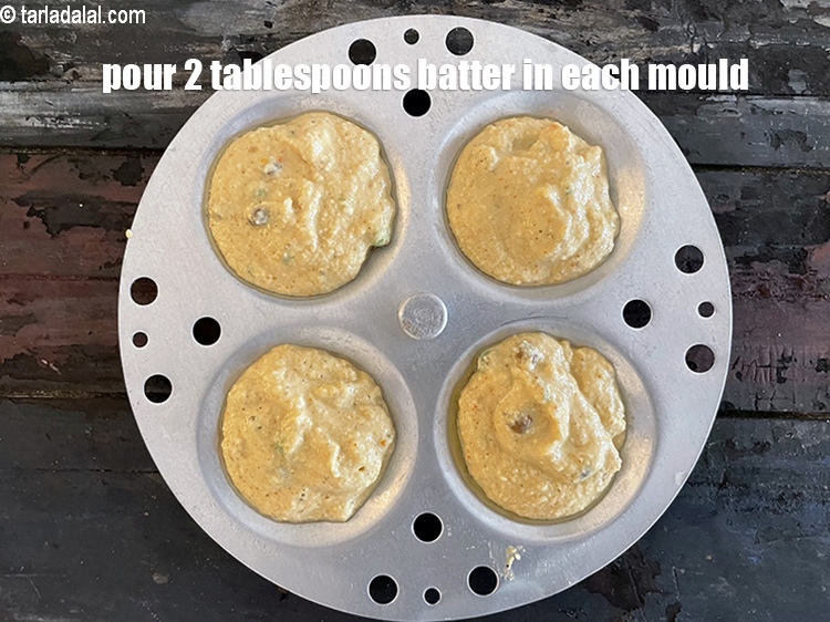 Step 41 – Pour 2 tablespoons batter on each idli mould.