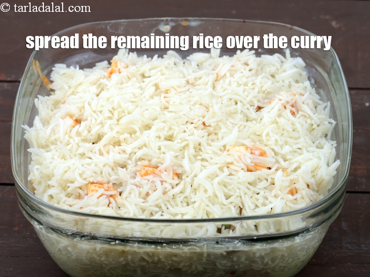 Step 43 – Spread the remaining rice over the curry.