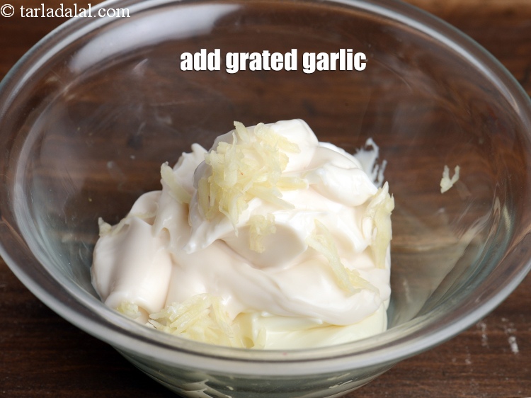 Step 5 – Add 1 tsp <a href="https://tarladalal.com/glossary-grated-garlic-859i">grated garlic (lehsun)</a>.