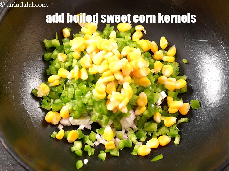 Step 5 – Add 1/4 cup <a href="https://www.tarladalal.com/glossary-boiled-sweet-corn-kernels-153i">boiled sweet corn kernels (makai ke dane)</a>.