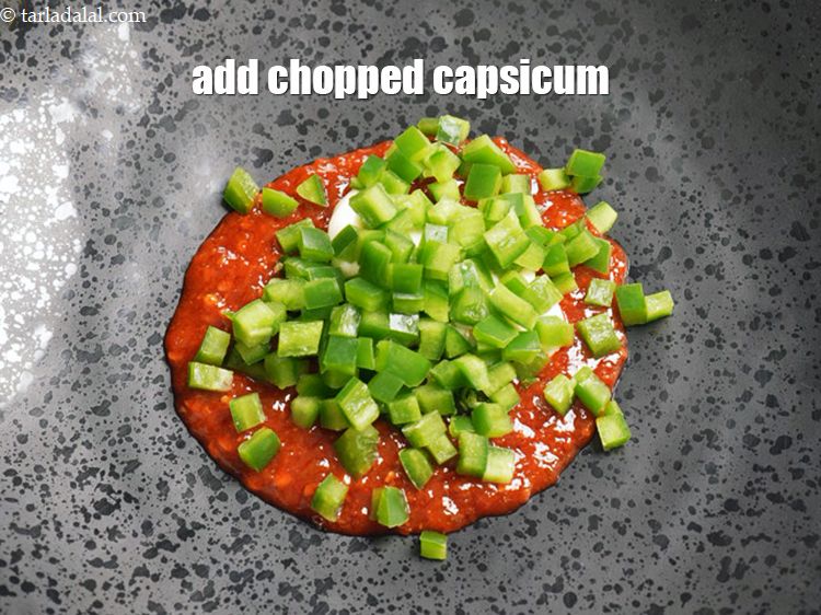Step 5 – Add &frac14; <a href="https://www.tarladalal.com/glossary-chopped-capsicum-164i">chopped capsicum</a>.