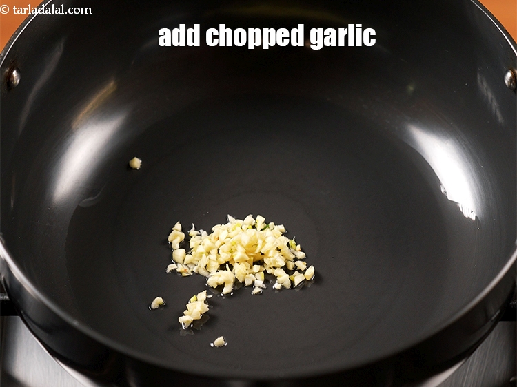 Step 9 – Add &frac12; tbsp of <a href="https://www.tarladalal.com/glossary-chopped-garlic-790i">chopped garlic (lehsun)</a>.