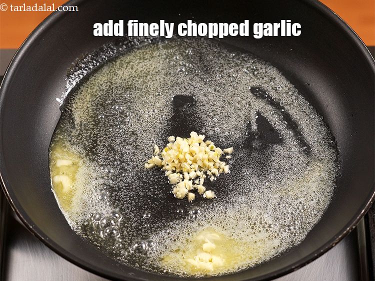 Step 7 – Add 1 tsp finely <a href="https://www.tarladalal.com/glossary-chopped-garlic-790i">chopped garlic (lehsun)</a>.
