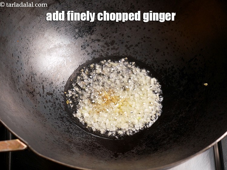 Step 5 – Add &frac12; tsp finely <a href="https://www.tarladalal.com/glossary-chopped-ginger-786i">chopped ginger (adrak)</a>.