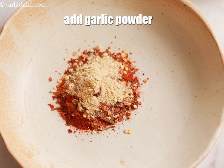 Step 5 – Add 3 tsp <a href="https://www.tarladalal.com/glossary-garlic-powder-lehsun-ka-powder-lahsun-ka-powder-351i">garlic (lehsun) powder</a>.