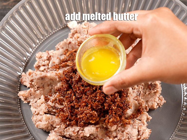 Step 8 – Add 1 tbsp <a href="https://www.tarladalal.com/glossary-melted-butter-1941i">melted butter</a>.