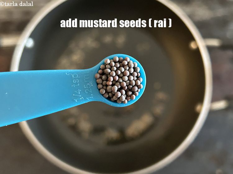 Step 6 – <meta charset="UTF-8" /> Add&nbsp;1/4 tsp&nbsp;<a href="glossary-mustard-seeds-sarson-rai-sarson-ke-beej-525i">mustard seeds ( rai / sarson)</a>.