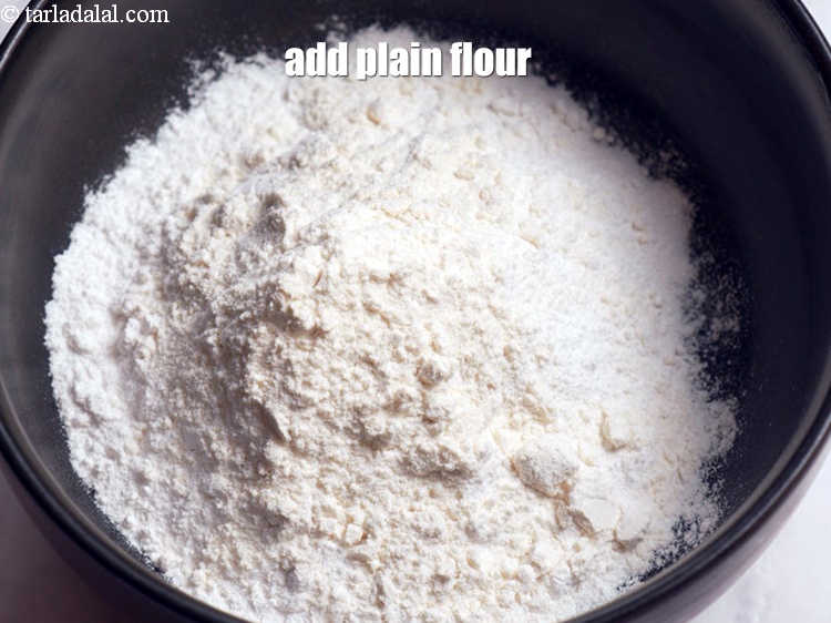 Step 5 – Add 1/4 cup <a href="https://www.tarladalal.com/glossary-plain-flour-maida-188i">plain flour (maida)</a>.
