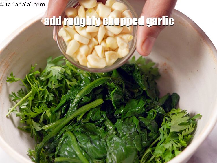 Step 5 – Add 2 tbsp roughly&nbsp;<a href="https://www.tarladalal.com/glossary-chopped-garlic-790i">chopped garlic (lehsun)</a>.